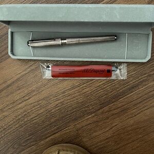 Elegant Silver ( believed to be 925 it is tarnished) 
Dupont Ballpoint pen